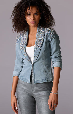 Models wearing a denim and embellished jacket, white tank and grep metallic pant.