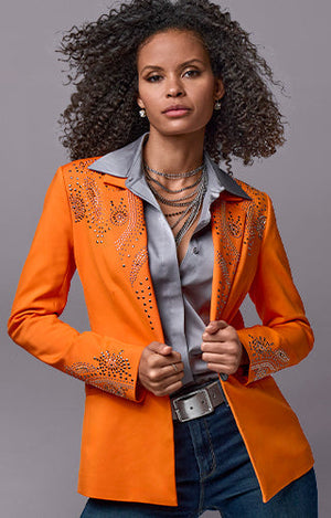 Models wearing a orange embellished jacket, silver button up and dark wash denim.